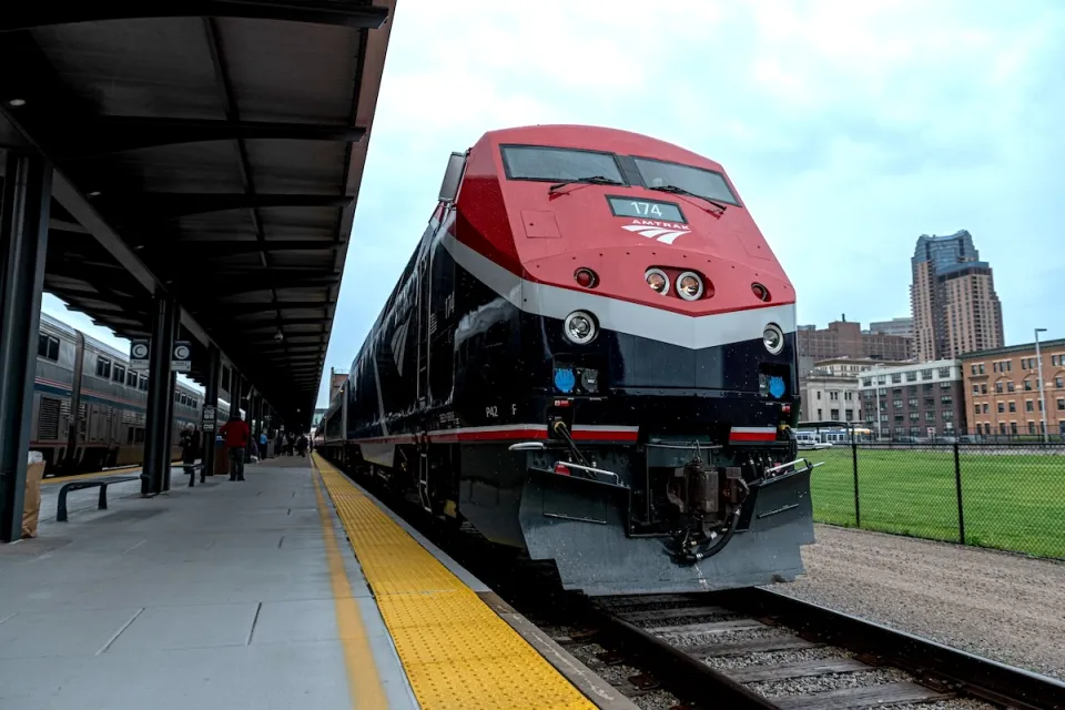 Close-up of red Amtrak Borealis train at station.